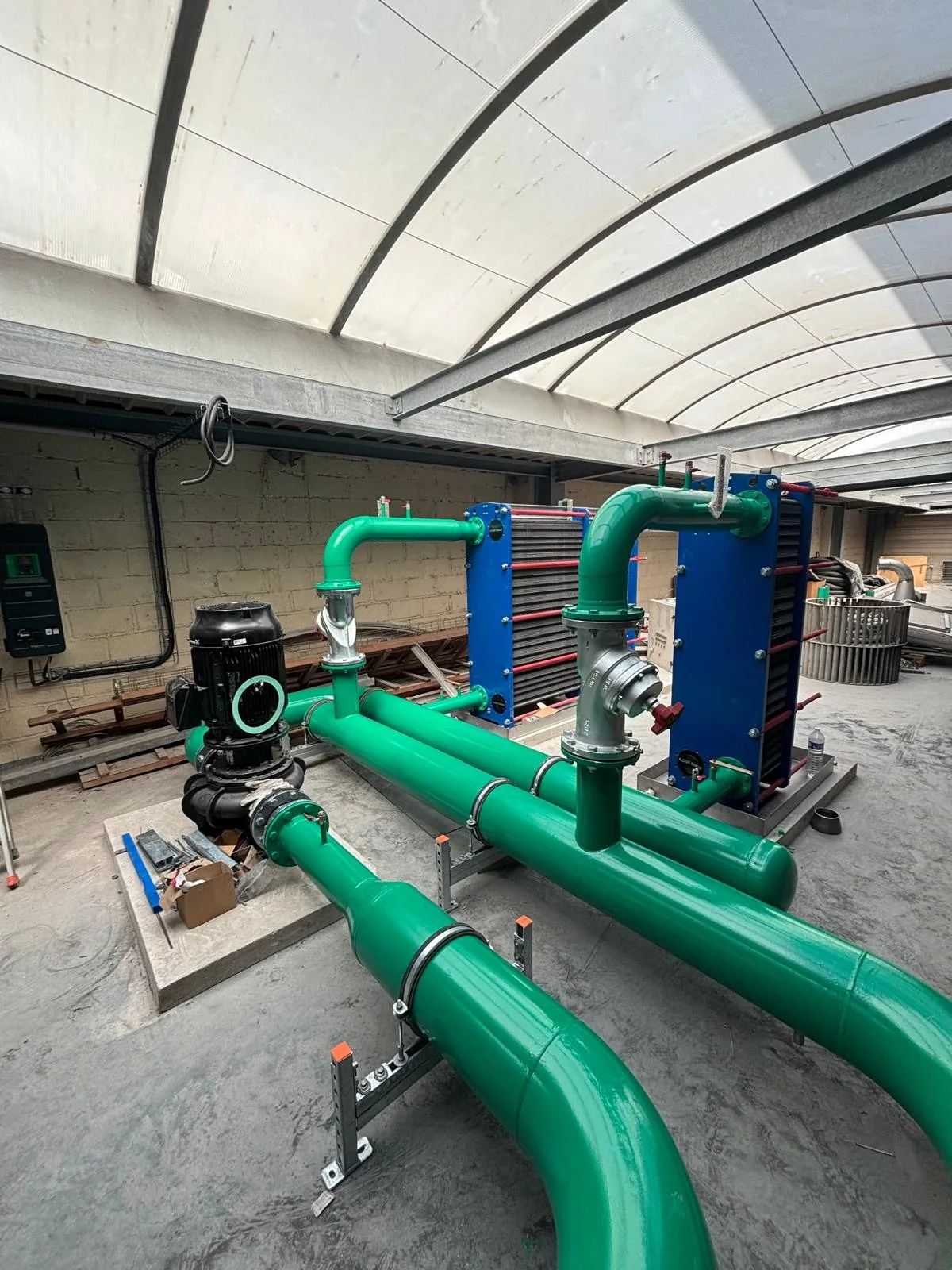 Plate heat exchangers and heat recovery pipework